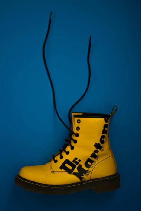unpaired yellow dr martens lace up boot